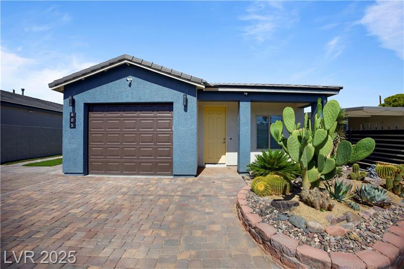 Modern new construction home with pool, landscaped yard, and upgraded interiors located at 605 North Yale Street in Las Vegas.