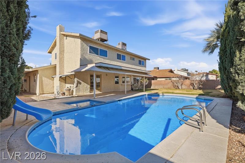 Modern Boulder City NV home with pool, mountain views, and spacious backyard